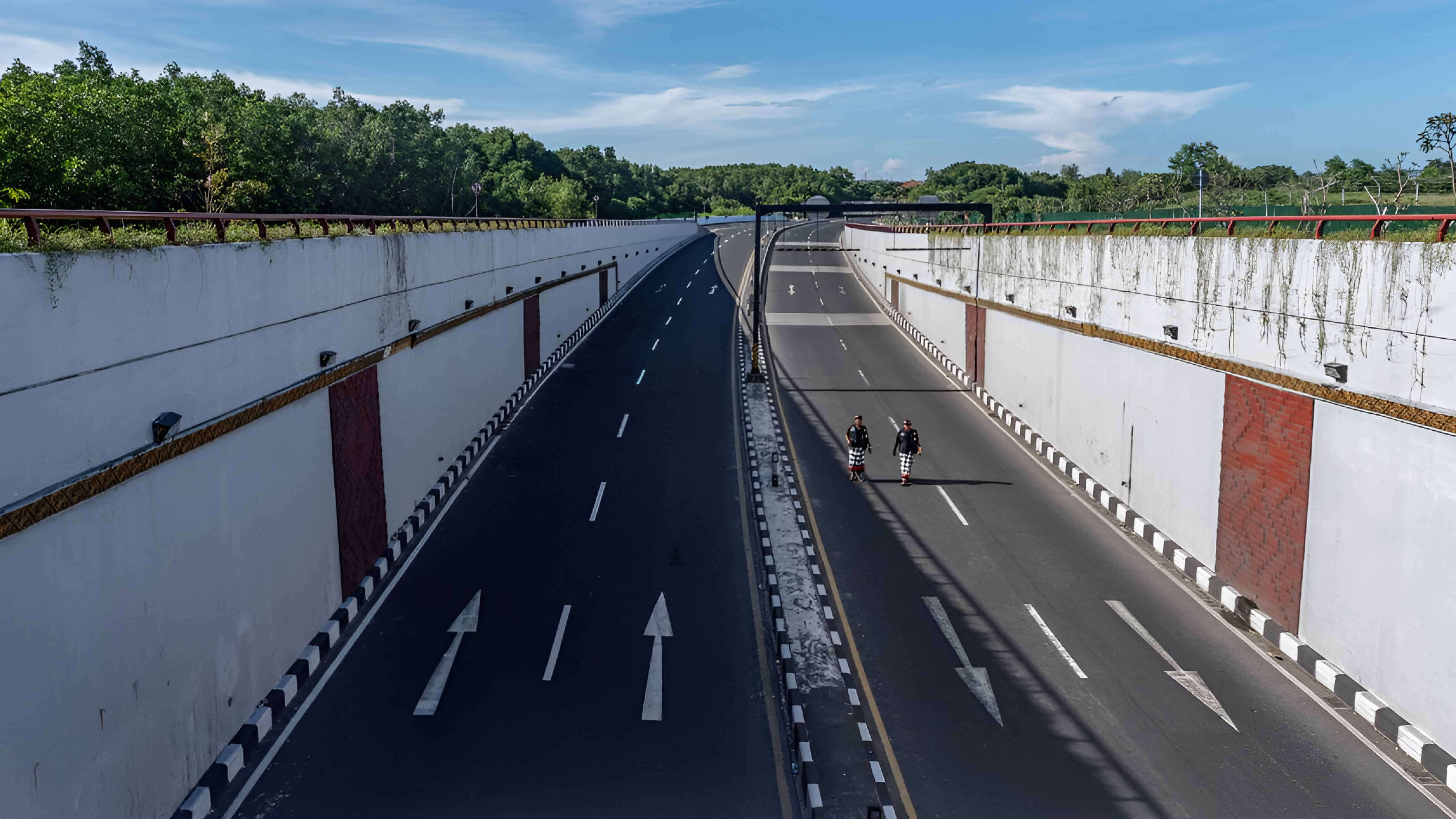 Pecalang traditional guards patrolling underpass in Bali for Nyepi Pecalang traditional guards patrolling underpass in Bali for Nyepi
